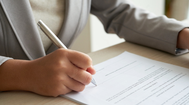 cropped-anonymous-business-woman-checking-agreement-before-signing